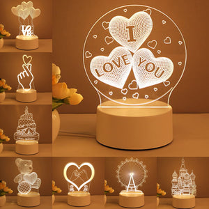 Heart-shaped night light with hands holding a flower and roses on a brown background