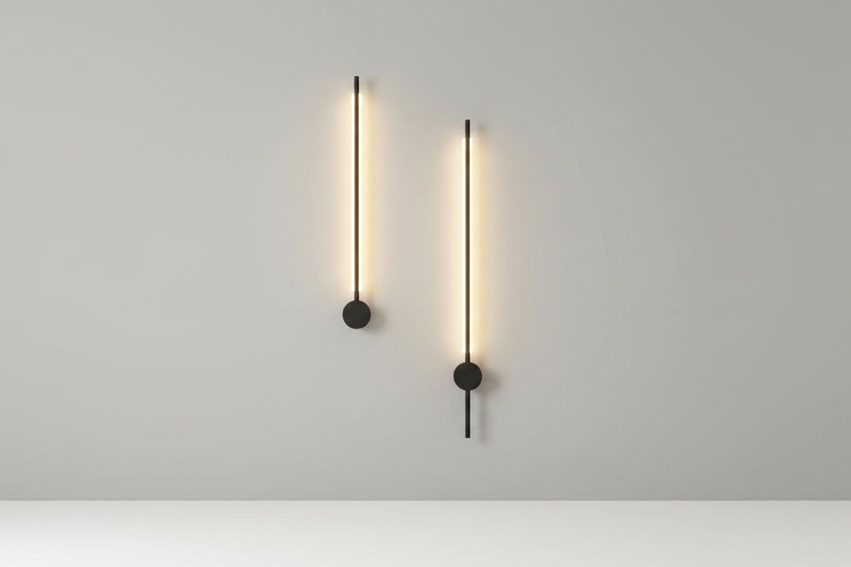 Modern wall lights on a gray wall in a stylish interior setting.