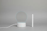 Heart-shaped light projection device on a dark background