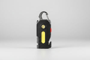 Black flashlight with carabiner on a white background