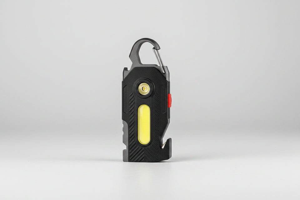 Black flashlight with carabiner on a white background