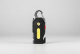 Black flashlight with carabiner on a white background