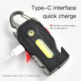 Black multi-tool with LED light and carabiner feature on a white background